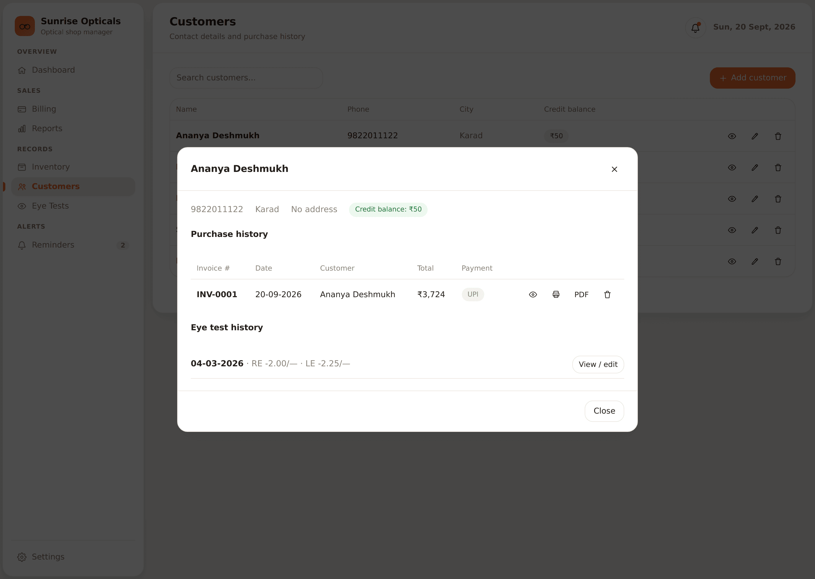OptiCare customer profile showing purchase history, eye test history, and loyalty credit balance